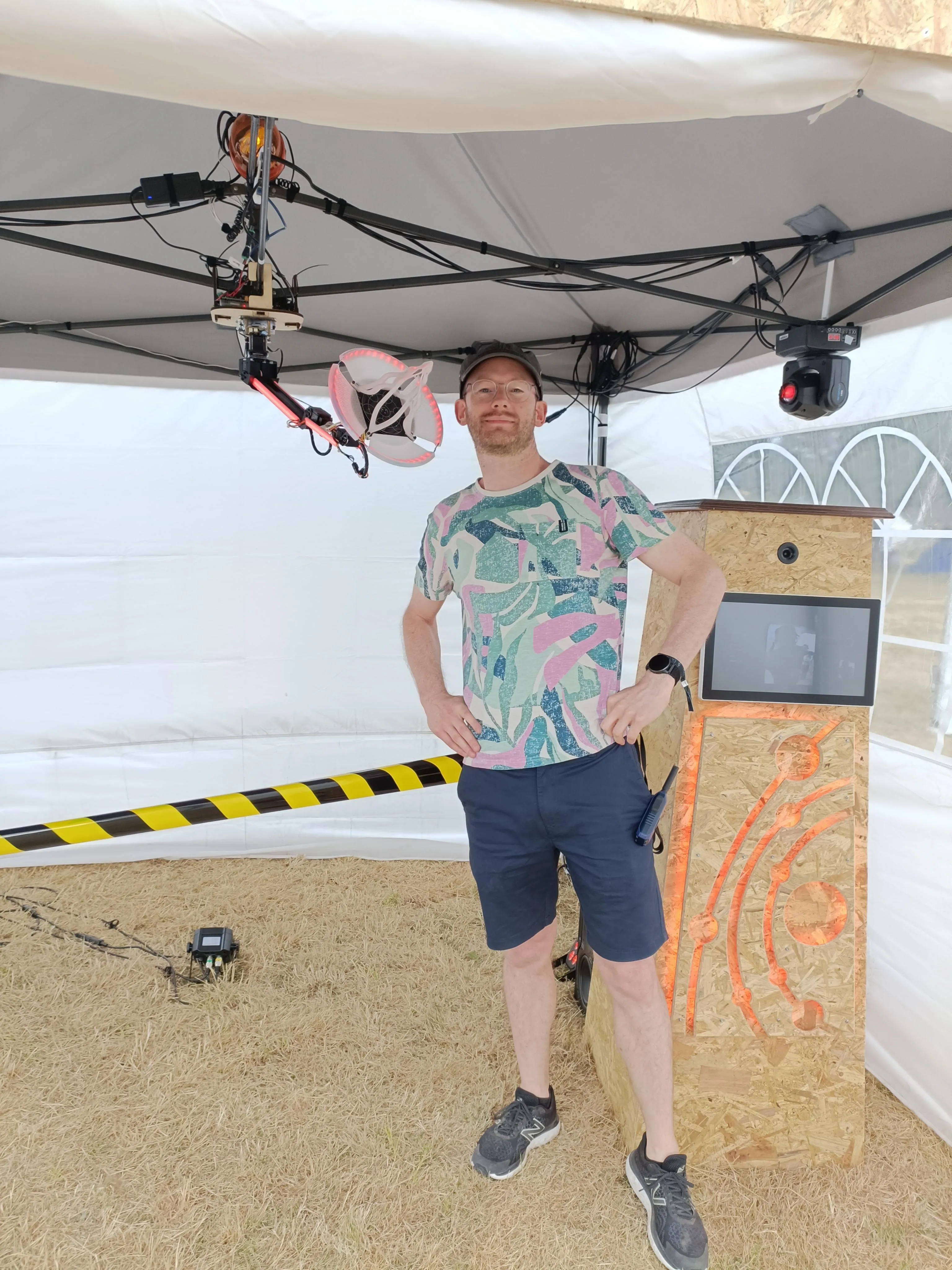 The author posing beneath the robot arm and antenna.