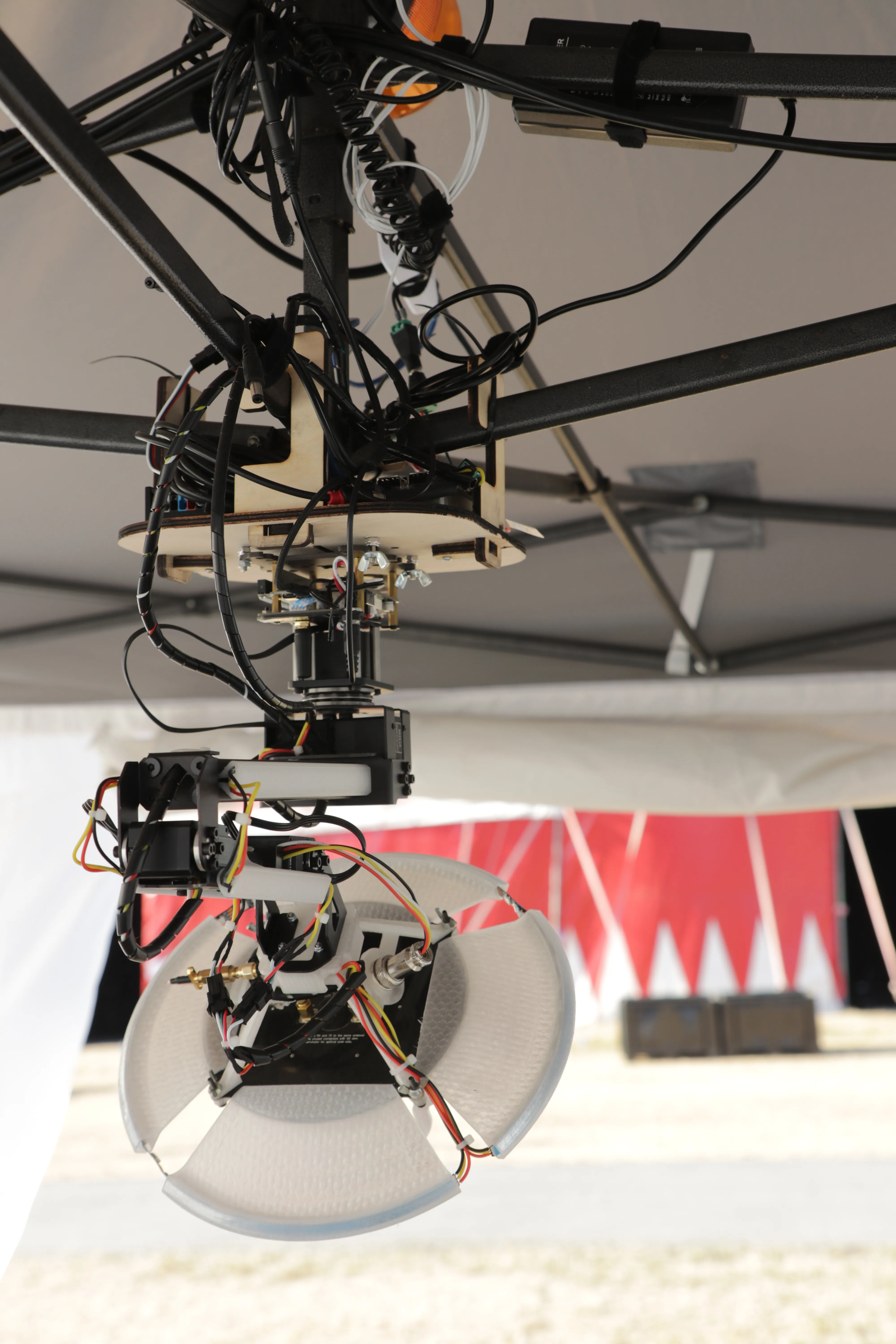 The arm, antenna and transmitter electronics hanging from the gazebo canopy, wiring and mounts visible.